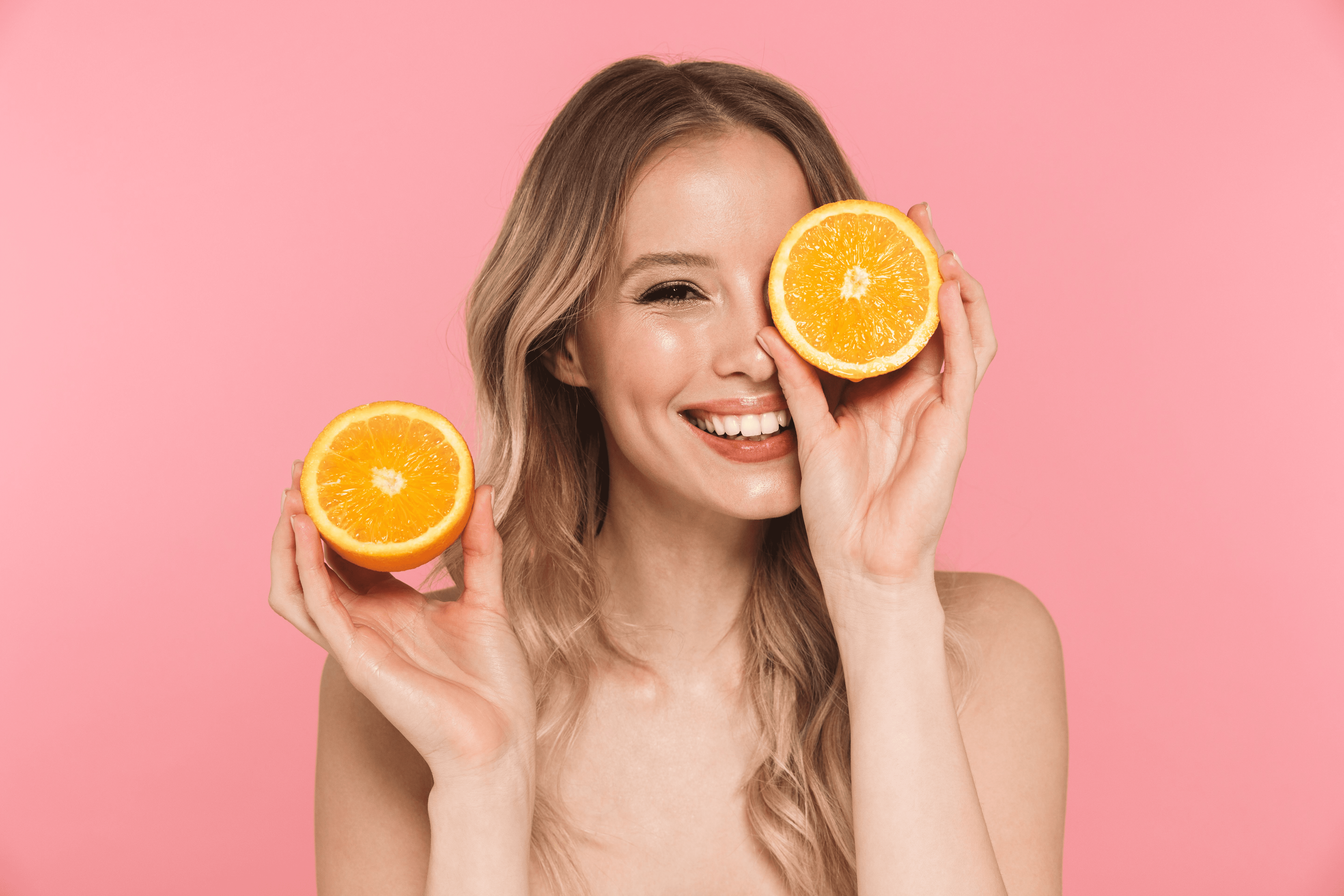women holding oranges